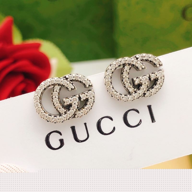 G*u*i earrings